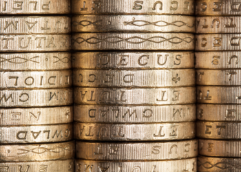 Stack of British pound coins, money, savings, pension